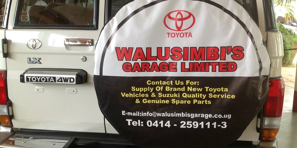 Walusimbi's Garage Tyre Banner at the back of a landcruiser old model  Cars for Sale Kampala Uganda, Ugabox
