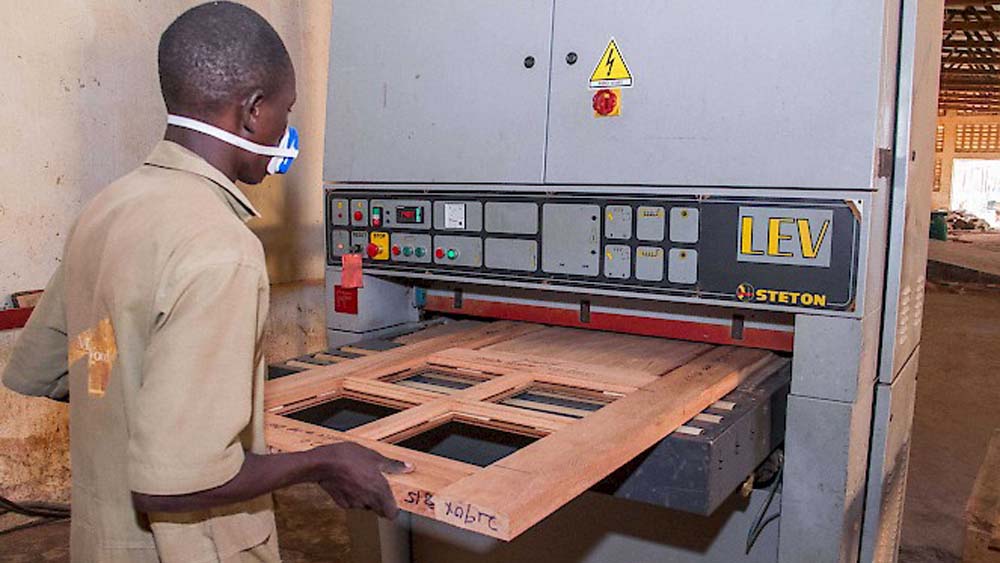 Door Manufacturing/Making at Masterwood Investments Factory in Luzira Kampala Uganda. Skilled Workmanship and Machine Made Quality Wood Products in Kampala Uganda. Ugabox.com