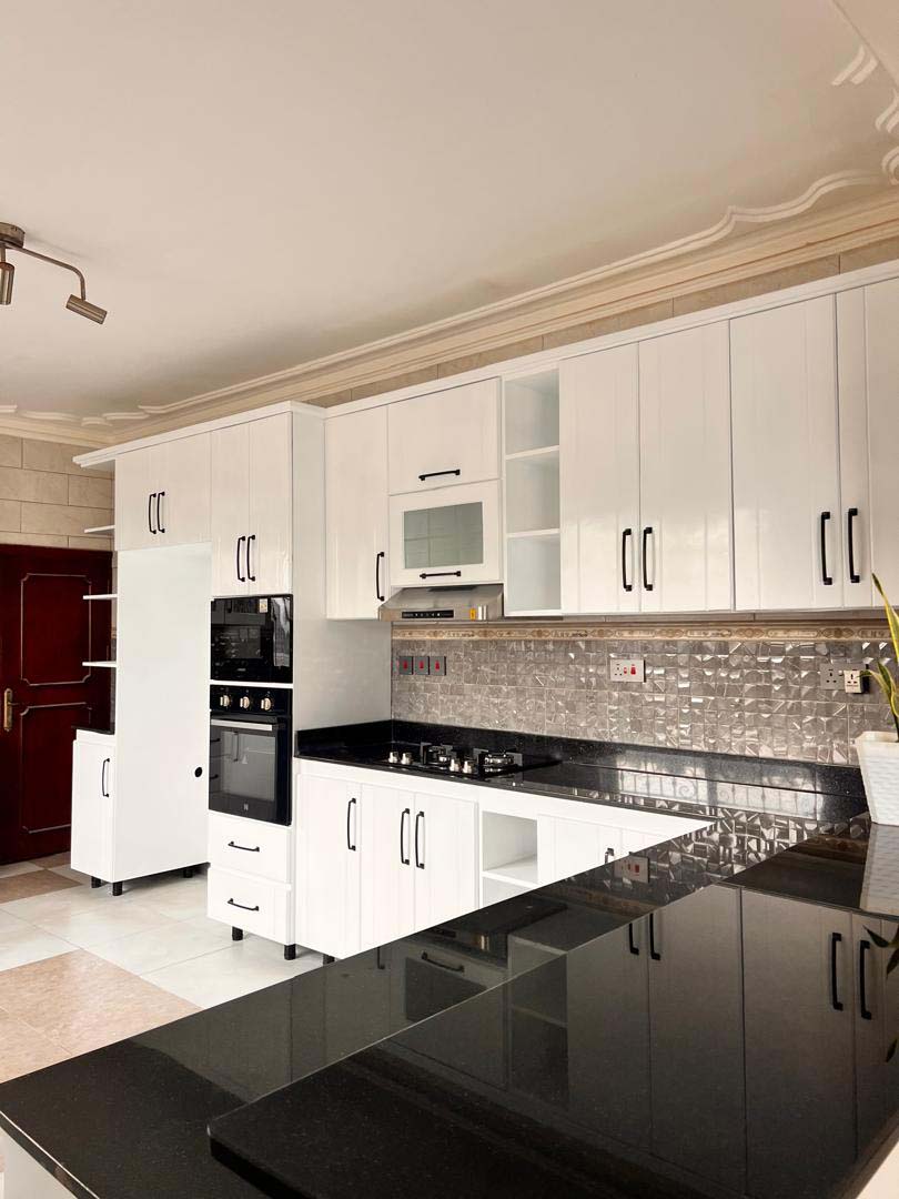 Kitchen cabinets design in Kampala Uganda. Wood cabinets installation. Trust Interiors Uganda. Leading interior design company in Uganda. Services: Interior design services, installation services, manufacturing of modern stylish furniture products in Uganda, East Africa. ugabox.com