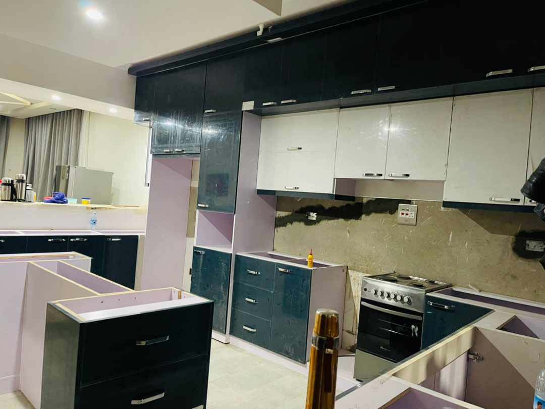 Kitchen cabinets design in Kampala Uganda. Wood cabinets installation. Trust Interiors Uganda. Leading interior design company in Uganda. Services: Interior design services, installation services, manufacturing of modern stylish furniture products in Uganda, East Africa. ugabox.com